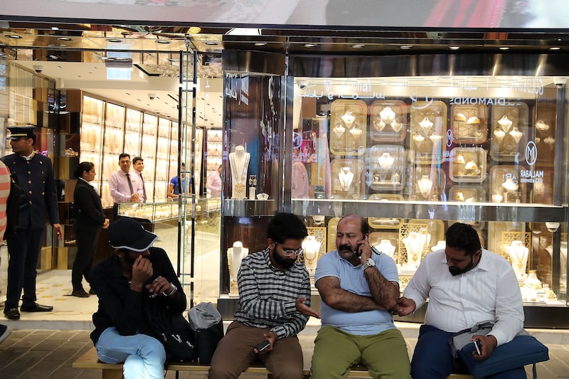People rest at the gold souq on a Ramadan afternoon