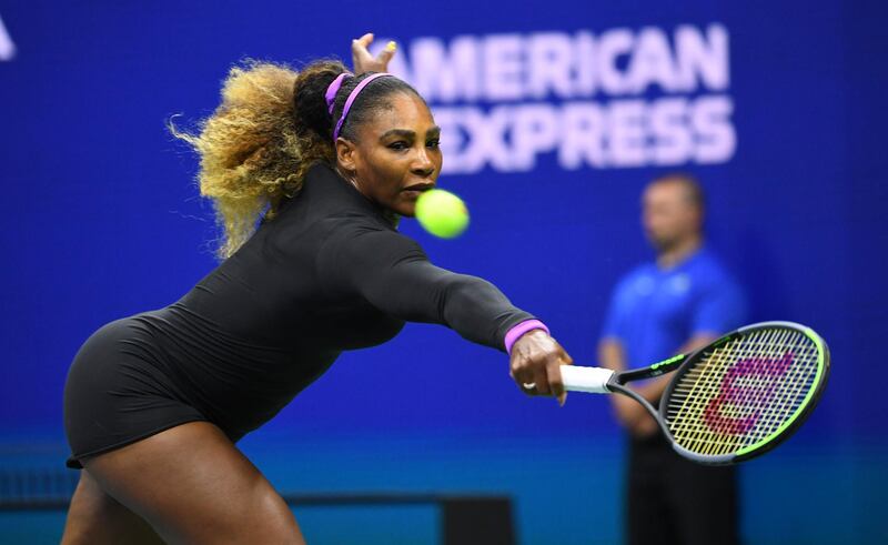 Serena Williams stretches to make a shot against Maria Sharapova. Reuters
