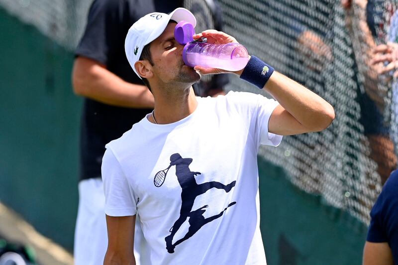 Novak Djokovic takes a break during practice. Reuters