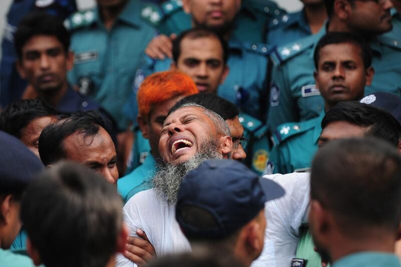 A Bangladeshi soldier following the announcement of his death penalty at a special court in Dhaka. The court sentenced at least 150 soldiers to death and jailed hundreds more over a 2009 military mutiny that left scores of top officers massacred. Munir uz Zaman / AFP



