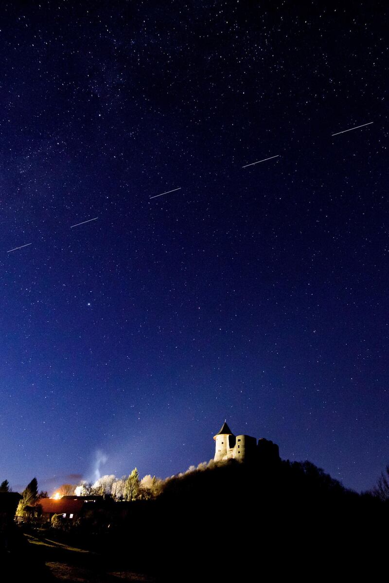 Starlink satellites are visible in the sky near Salgotarjan, Hungary.  EPA