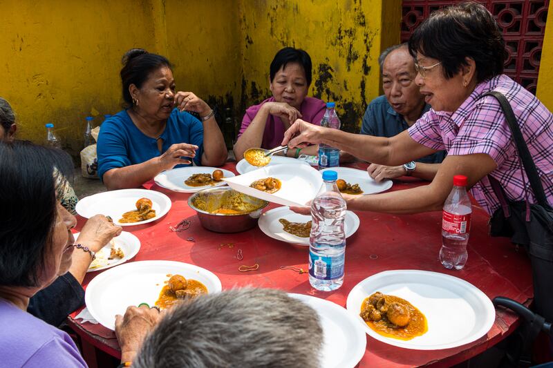 Pilgrims bond over a hearty feast