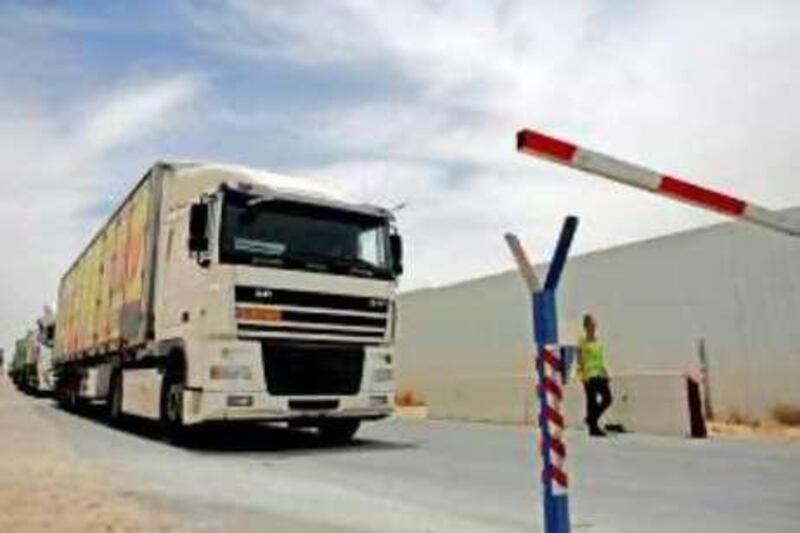 epa02182255 A regular supply truck is about to enter the Gaza Strip at the Kerem Shalom border crossing in southern Israel, on 01 June 2010. A flotilla of several ships heading to Gaza were boarded by Israeli comandos earlier with considerable loss of life. A long-anticipated Israeli takeover of six ships carrying humanitarian aid for the Gaza Strip turned bloody and violent early 31 May, with at least 10 foreign

activists confirmed killed and dozens injured. Seven Israeli soldiers were also injured, one seriously and one critically. Other unconfirmed reports said as many as 16 activists were killed. Some 50 people are reported injured. While the activists are detained the seized aid materials on the boats will be brought to Gaza through Kerem Shalom but the process will take 'days if not weeks', according to an IDF spokesperson.  EPA/OLIVER WEIKEN *** Local Caption ***  02182255.jpg *** Local Caption ***  02182255.jpg