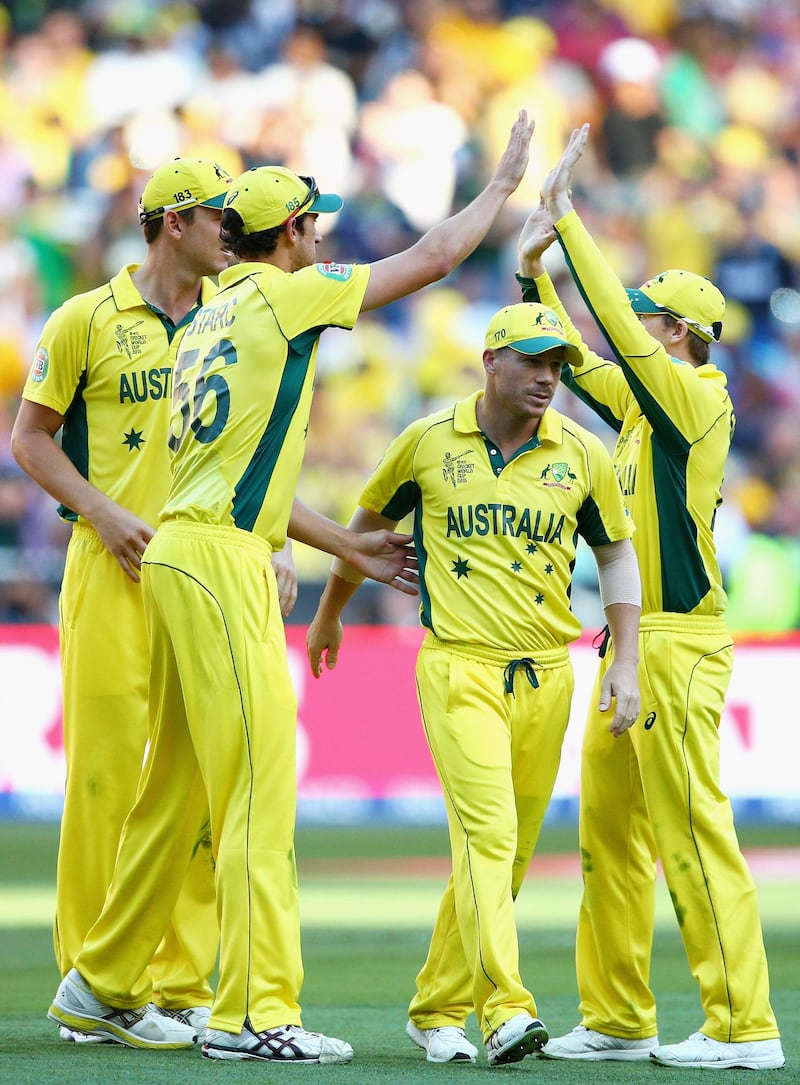 MELBOURNE, AUSTRALIA - MARCH 29: Australian players celebrate the final wicket of the New Zealand innings during the 2015 ICC Cricket World Cup final match between Australia and New Zealand at Melbourne Cricket Ground on March 29, 2015 in Melbourne, Australia.  (Photo by Cameron Spencer/Getty Images)