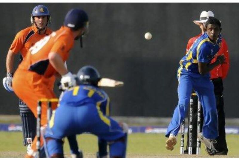 Ajantha Mendis, right, bowled Sri Lanka to a 156-run victory over the Netherlands yesterday. Ishara S Kodikara / AFP