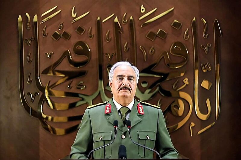 This image grab taken from a video published by the War Information Division of military strongman Khalifa Haftar's self-proclaimed Libyan National Army (LNA) on April 28, 2020 shows Haftar giving a speech, saying he had "a popular mandate" to govern the country, declaring a key 2015 political deal over and vowing to press his assault to seize Tripoli. In a speech on his Libya al-Hadath TV channel, Haftar said his self-styled Libyan "army" was "proud to be mandated with the historic task" of leading Libya. He did not make clear whether an elected parliament in the country's east, a signatory to the deal, backed his move -- or what its future role would be. Haftar has so far drawn his legitimacy from the administration based in the country's east, and last April his forces launched an assault to seize the capital Tripoli, in the west, from the Government of National Accord. - RESTRICTED TO EDITORIAL USE - MANDATORY CREDIT "AFP PHOTO / LNA WAR INFORMATION DIVISION" - NO MARKETING NO ADVERTISING CAMPAIGNS - DISTRIBUTED AS A SERVICE TO CLIENTS
 / AFP / LNA War Information Division / - / RESTRICTED TO EDITORIAL USE - MANDATORY CREDIT "AFP PHOTO / LNA WAR INFORMATION DIVISION" - NO MARKETING NO ADVERTISING CAMPAIGNS - DISTRIBUTED AS A SERVICE TO CLIENTS
