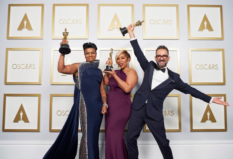 Jamika Wilson, Sergio Lopez-Rivera and Mia Neal pose backstage with the Oscar for Make-Up and Hairstyling for 'Ma Rainey's Black Bottom' at the Academy Awards in Los Angeles, California. Reuters