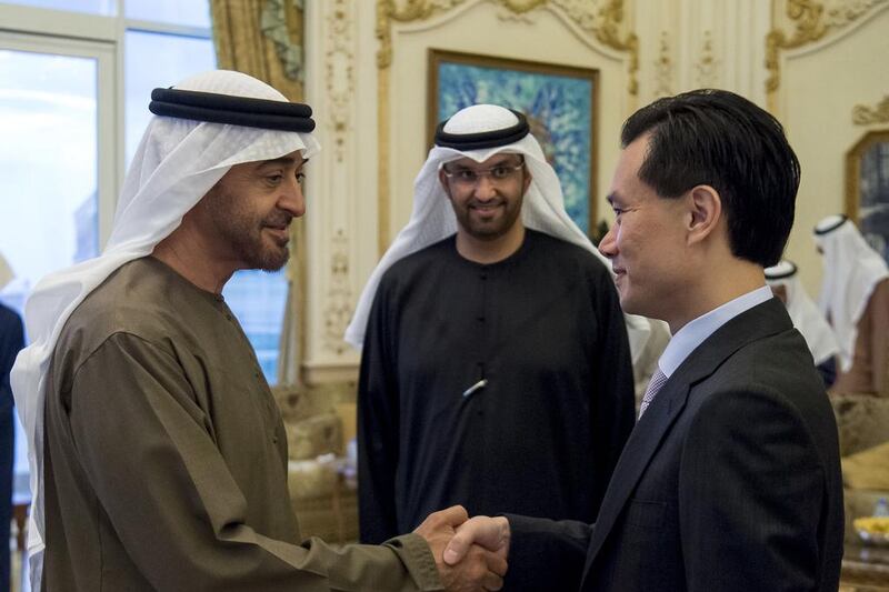 Sheikh Mohammed bin Zayed, Crown Prince of Abu Dhabi and Deputy Supreme Commander of the Armed Forces, greets Ye Jianming, Chairman of CEFC China Energy Company Limited, during a Sea Palace barza. With them is Dr Sultan Ahmed Al Jaber, Minister of State, Chairman of Masdar and Chief Executive of Adnoc Group. Rashed Al Mansoori / Crown Prince Court - Abu Dhabi