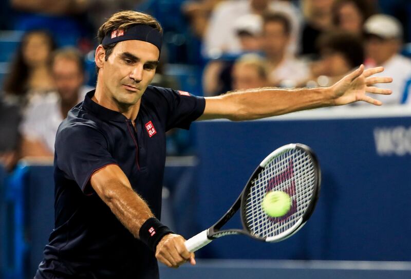 epa06955323 Roger Federer of Switzerland in action against Stan Wawrinka of Switzerland in their quarterfinal match in the Western and Southern Open tennis tournament at the Lindner Family Tennis Center in Mason, Ohio, USA, 17 August 2018.  EPA/TANNEN MAURY