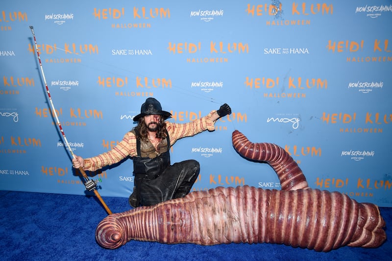Quite the catch. Klum's husband Tom Kaulitz dressed as a fisherman. Invision / AP