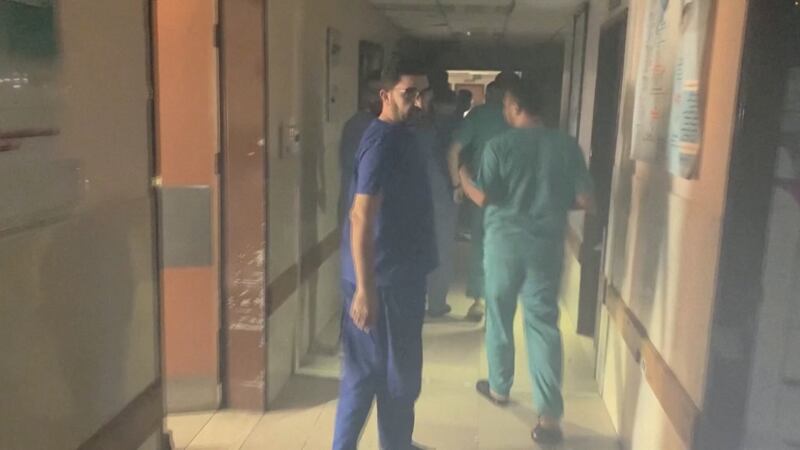 Medics look at the damages in the smoke-filled wards inside Al Shifa hospital following an Israeli raid. Reuters