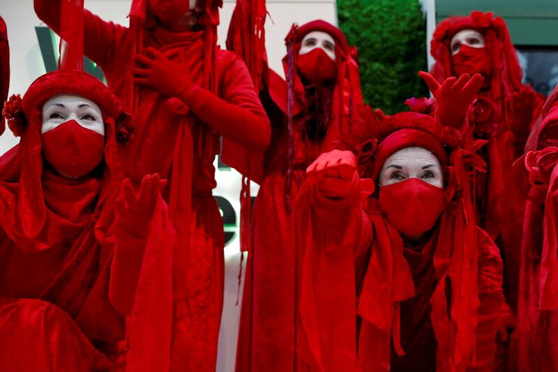 Red Rebellion activists participate in a protest at Glasgow Central Station. Reuters