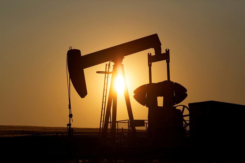 FILE PHOTO: FILE PHOTO: An oil pump jack pumps oil in a field near Calgary, Alberta, Canada on July 21, 2014.  REUTERS/Todd Korol/File Photo/File Photo