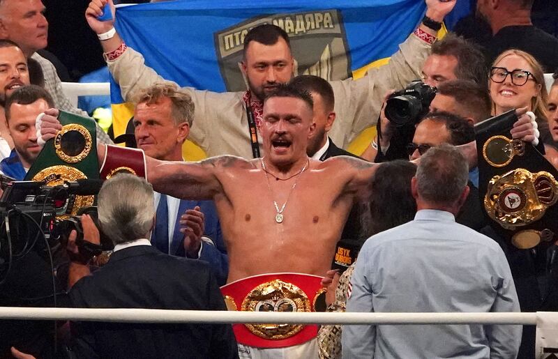 Oleksandr Usyk celebrates winning his fight against Daniel Dubois at Tarczynski Arena in Wroclaw, Poland. AFP