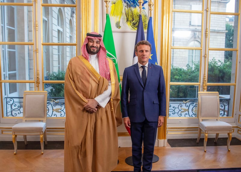 French President Emmanuel Macron welcoming Saudi Arabi's Crown Prince Mohammed bin Salman. AFP