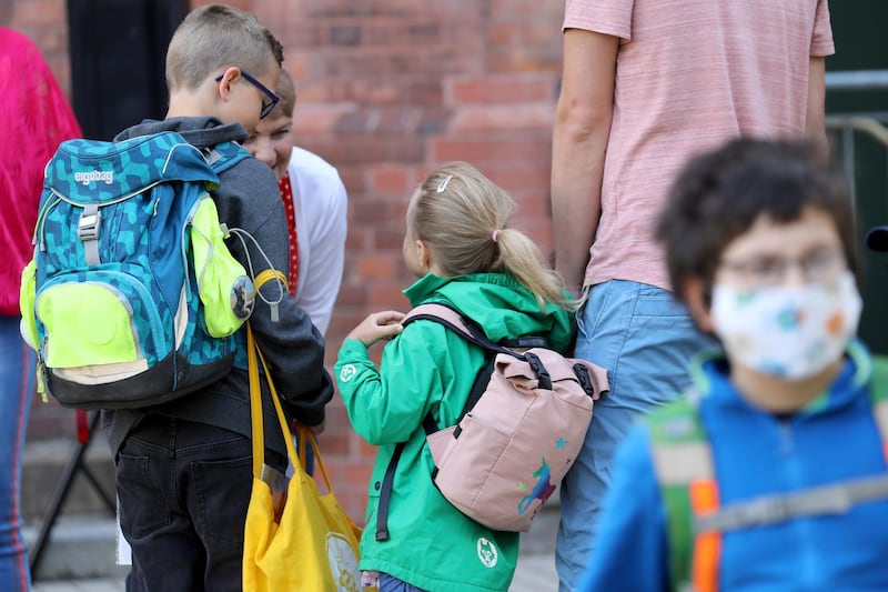 Students are brought to school by their parents in Rostock, Germany, as Mecklenburg-Western Pomerania is the first federal state to resume regular school operations. dpa via AP