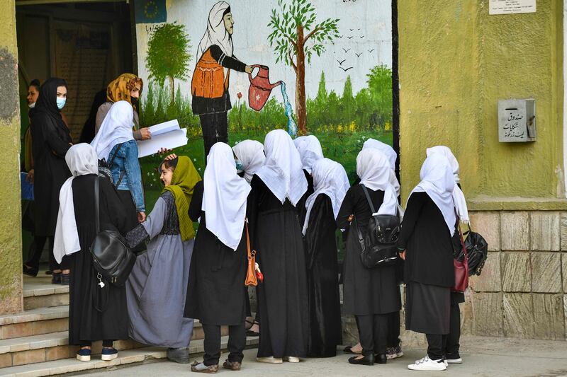 Girls arrive at school in Kabul. The reopening of secondary schools for girls across Afghanistan on March 23 prompted joy and apprehension among students. AFP
