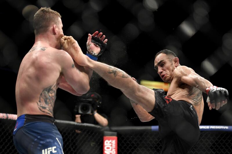 Tony Ferguson kicks Justin Gaethje in their interim lightweight title fight during UFC 249. AFP
