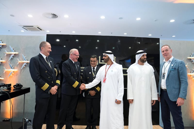 ABU DHABI, UNITED ARAB EMIRATES - November 24, 2018: HH Sheikh Mohamed bin Zayed Al Nahyan, Crown Prince of Abu Dhabi and Deputy Supreme Commander of the UAE Armed Forces (3rd R) and HE Mohamed Mubarak Al Mazrouei, Undersecretary of the Crown Prince Court of Abu Dhabi and Chairman of Etihad Airways (2nd R), visit the Etihad Airways stand on the second day of the 2018 Formula 1 Etihad Airways Abu Dhabi Grand Prix, at Yas Marina Circuit. 

( Mohamed Al Hammadi / Ministry of Presidential Affairs )
---