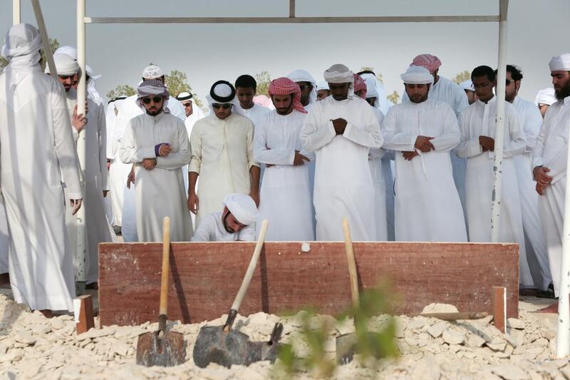 Several dignitaries attended the funeral of Ali Khalil Abdullah Al Hosani, a national service recruit, at Baniyas graveyard. Christopher Pike / The National