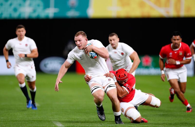 England's Sam Underhill in action with Tonga's Sione Kalamafoni at the Sapporo Dome in Japan. Reuters