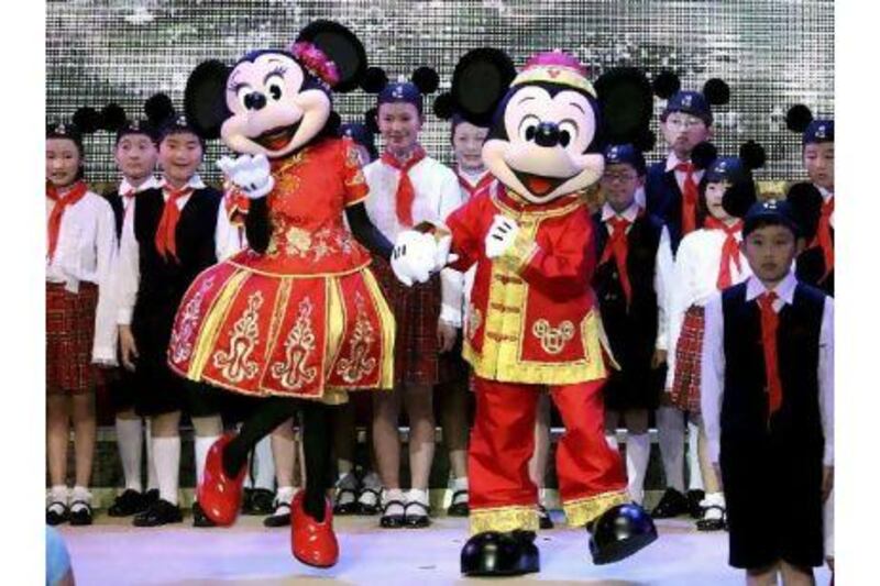 Mickey and Minnie dance during a celebration held for the start of construction work on Shanghai Disneyland on Friday. Xinhua / AP Photo