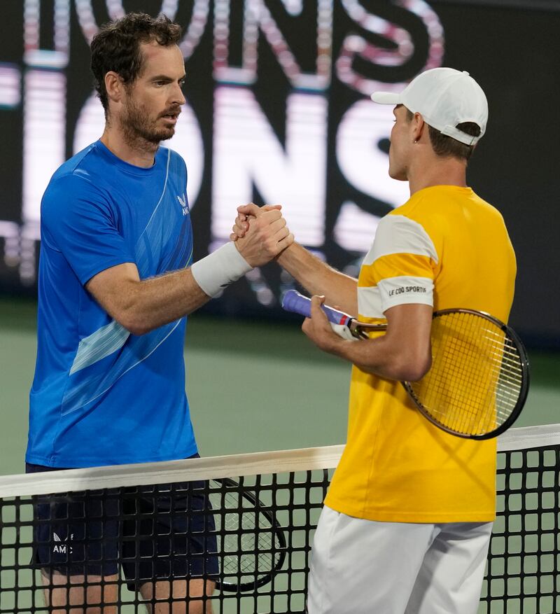 Andy Murray shakes hands with Christopher O'Connell after winning their Dubai Duty Free Tennis Championships first-round match. AP