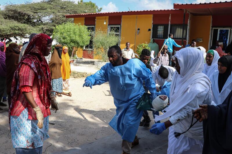Nurses carry a person, who was wounded during a car bombing attack, at the Madina Hospital in Mogadishu. AFP