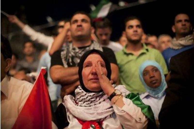 A Palestinian woman cries in Ramallah, West Bank, during the speech of President Mahmoud Abbas at the UN General Assembly.