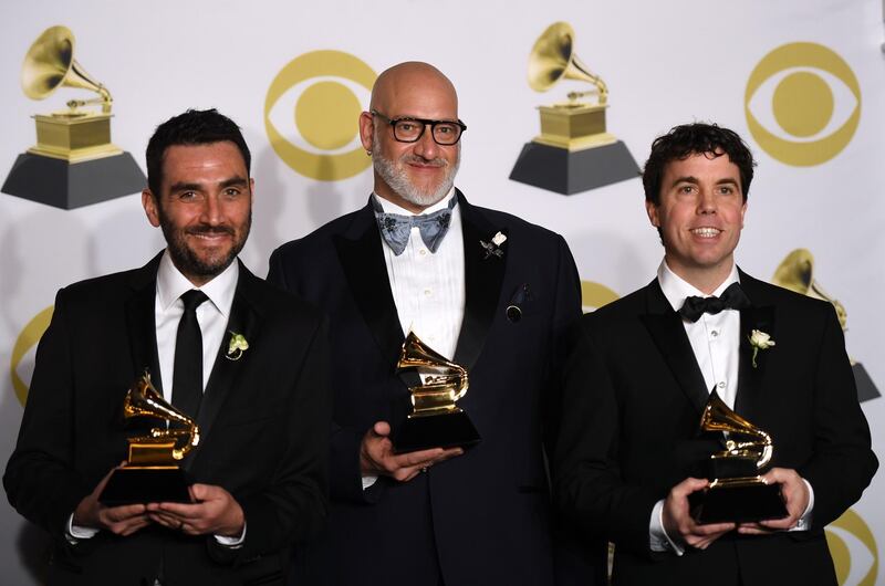 Lawrence Azerrad, Timonthy Daly, and David Pescovitz hold the trophy for Best Boxed Or Special Limited Edition Package in the press room. AFP