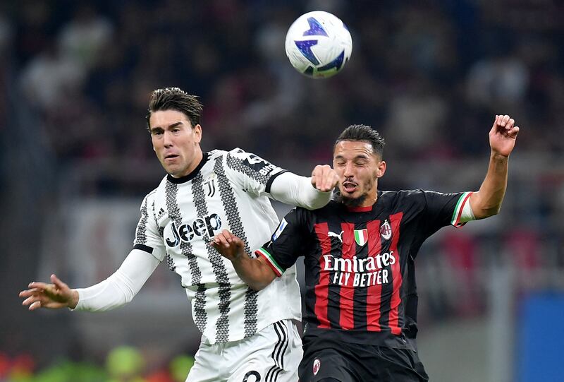 Juventus forward Dusan Vlahovic and AC Milan midfielder Ismael Bennacer challenge for a header. Reuters