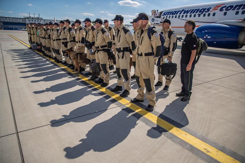 Czech Urban Search and Rescue (USAR) personnel prepare for boarding at the Vaclav Havel Airport in Prague, Czech Republic.  EPA