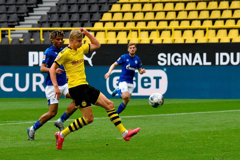 Dortmund's Erling Braut Haaland scores the opening goal against Schalke. AFP