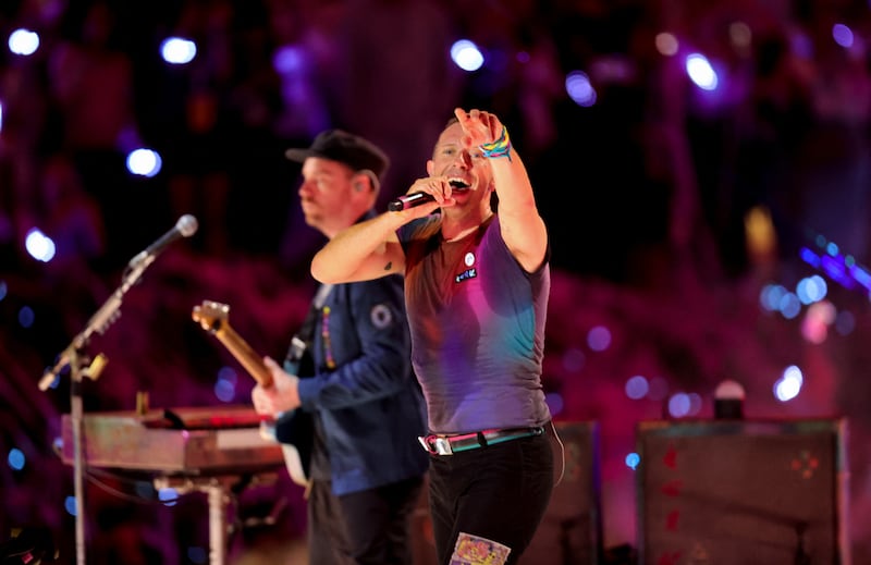 Chris Martin and Jonny Buckland of Coldplay perform at Expo 2020 Dubai.