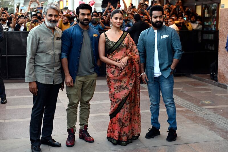 From left, director Rajamouli with actors Charan, Bhatt and Rao Jr at a promotional event in New Delhi. AFP