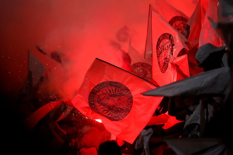 Fans light up flares during the Europa League final. AP