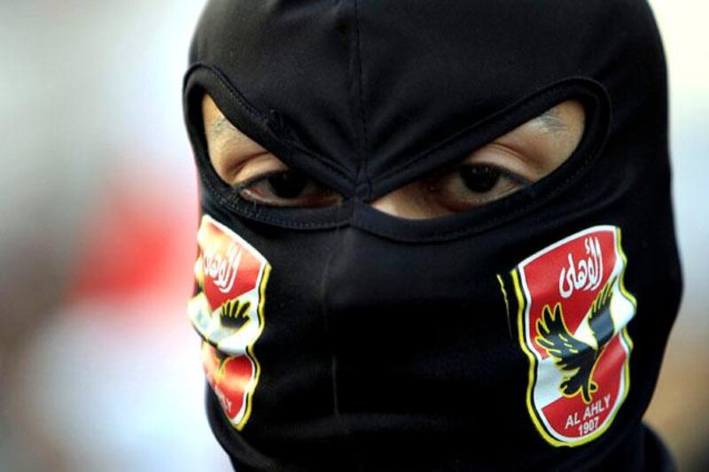 A member of the Black Bloc is seen during the protest in Tahrir Square in Cairo January 25, 2013. Egypt marks the second anniversary of the uprising that swept Hosni Mubarak from power with little to celebrate. Deeply divided and facing an economic crisis, the nation is bracing for more protests, but this time against a freely elected leader.REUTERS/Mohamed Abd El Ghany (EGYPT - Tags: POLITICS CIVIL UNREST)