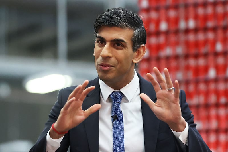 Britain's Prime Minister Rishi Sunak meets local business leaders during a visit to a Coca-Cola bottling plant in Lisburn, Northern Ireland, on February 28. AFP