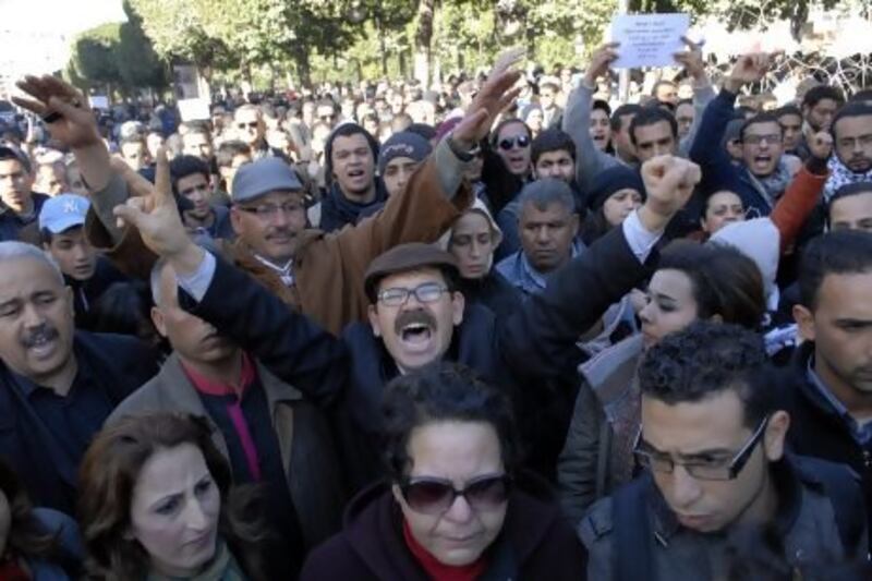 Tunisians shout slogans as they protest the killing of Chokri Belaid, the general secretary of the secular Tunisian Democratic Patriots party, who was shot dead earlier in the day, in Tunis. EPA