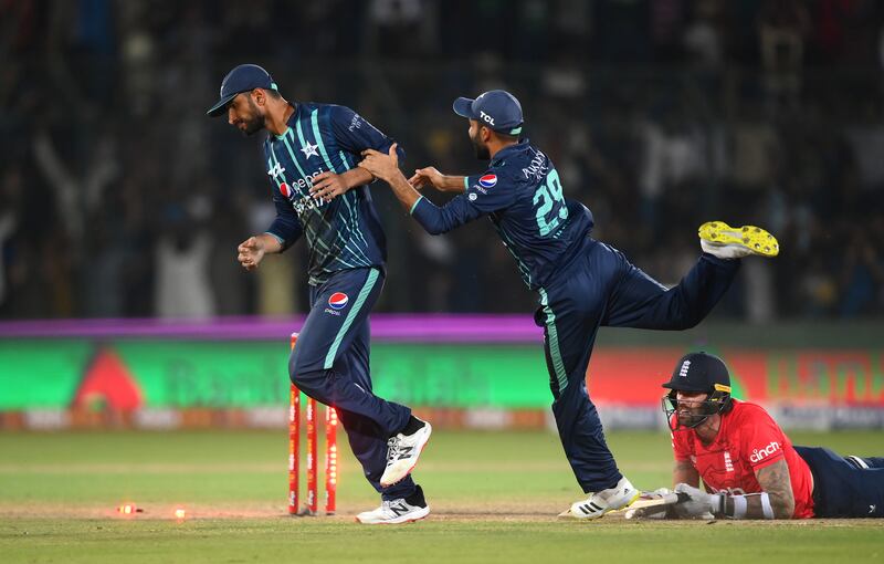 Shan Masood celebrates running out Reece Topley with Haris Rauf. Getty