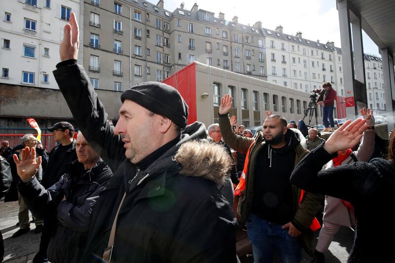 Anasse Kazib (C), signalman and Sud Rail labour union member, votes during a meeting at the Gare du Nord train station on the second day of a nationwide strike by French SNCF railway workers, in Paris, France, April 4, 2018.   REUTERS/Philippe Wojazer