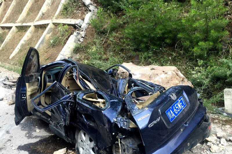 A car damaged during an earthquake is seen in Jiuzhaigou in China's southwestern Sichuan province.  AFP