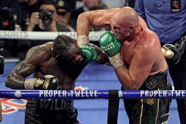Tyson Fury slams a right to the head of  Deontay Wilder during their WBC heavyweight title fight in Las Vegas in February. AFP
