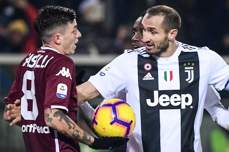 Torino midfielder Daniele Baselli, left, argues with Juventus defender Giorgio Chiellini after Juve opened the scoring. AFP