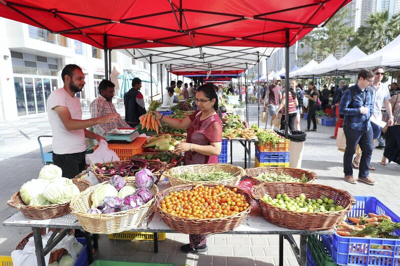 DUBAI , UNITED ARAB EMIRATES , January 18 – 2019 :- People buying vegetable , fruits and other organic items at the Farmers Market held at the Bay Avenue in Business Bay in Dubai. (Pawan Singh / The National ) For News/Online/Instagram. Story by Patrick