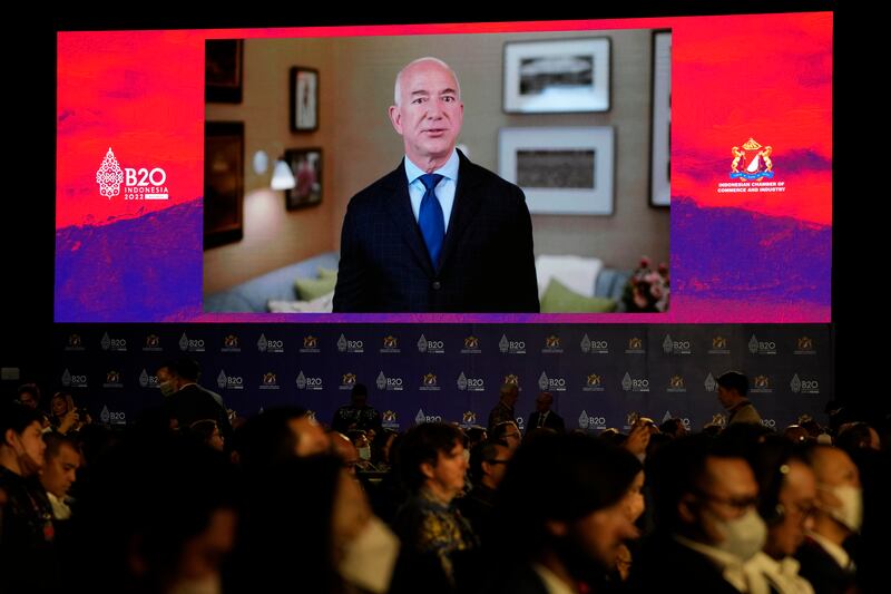 A video by Amazon and Bezos Earth Fund executive chairman Jeff Bezos is displayed at the B20 Summit for business leaders, held before the G20 leaders summit. AP 