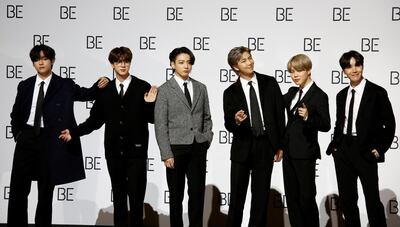 FILE PHOTO: Members of K-pop boy band BTS pose for photographs during a news conference promoting their new album "BE(Deluxe Edition)" in Seoul, South Korea, November 20, 2020.  REUTERS/Heo Ran/File Photo