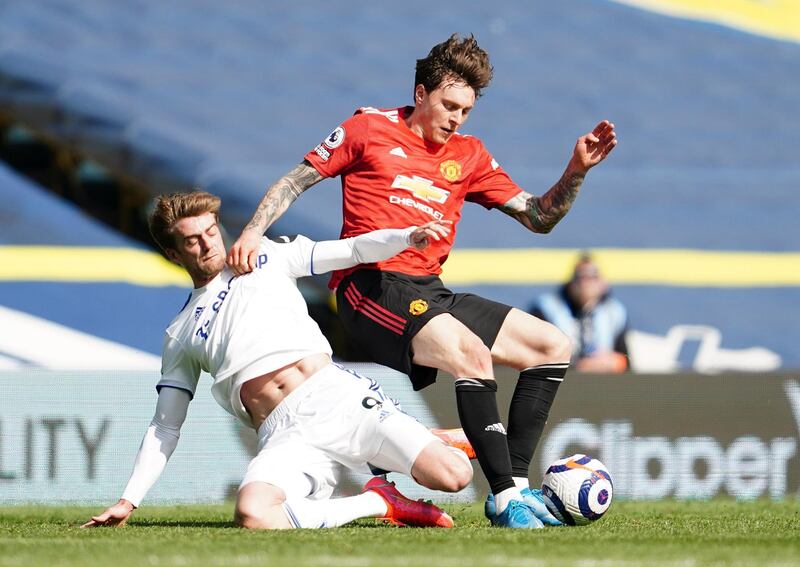 Manchester United's Victor Lindelof is challenged by Leeds United's Patrick Bamford at Elland Road on Sunday April 25, 2021. AP
