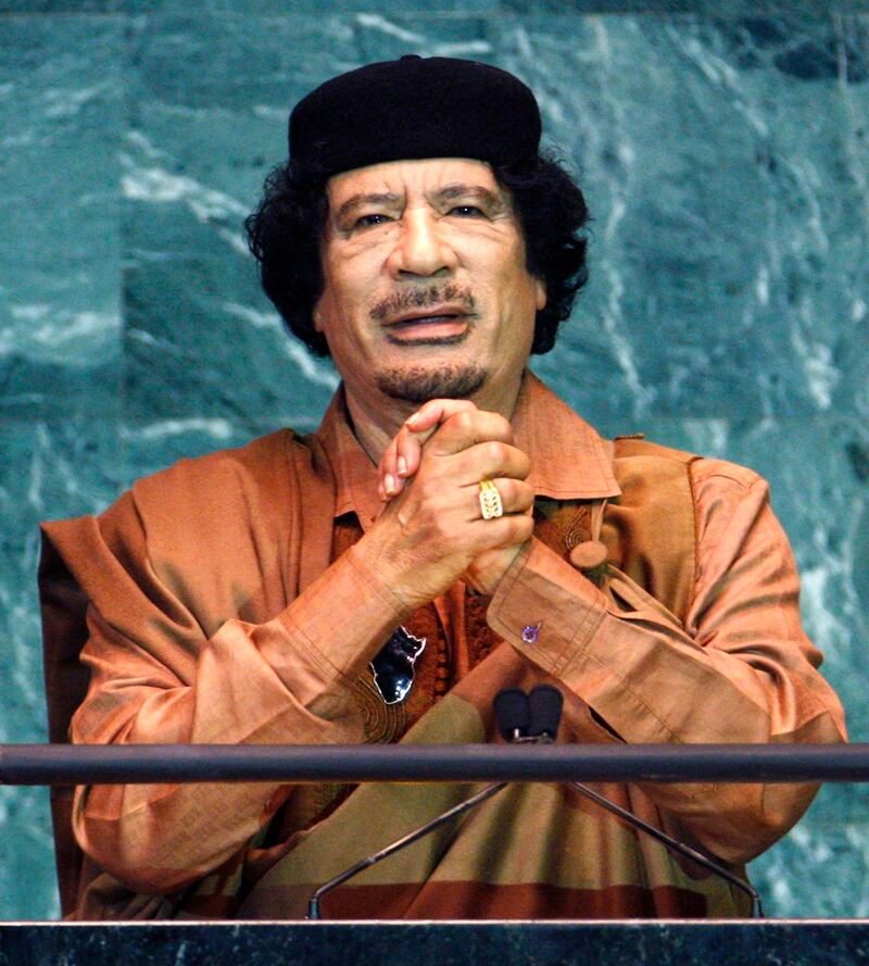 Libya's leader Muammar Gaddafi addresses the 64th United Nations General Assembly at the U.N.headquarters in New York in this September 23, 2009 file photo. Deposed Libyan leader Gaddafi was captured and wounded near his hometown of Sirte at dawn on October 20, 2011 as he tried to flee in a convoy which NATO warplanes attacked, National Transitional Council official Abdel Majid said on Thursday.    REUTERS/Mike Segar/Files (UNITED STATESPOLITICS DAY - Tags: POLITICS CIVIL UNREST) *** Local Caption ***  SIN704_LIBYA-_1020_11.JPG
