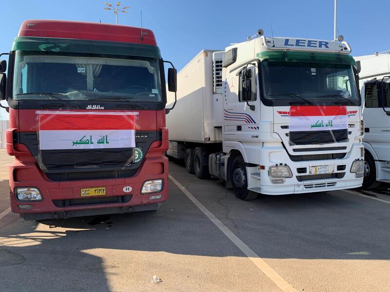 Iraqi trucks wait to cross into Saudi. Reuters